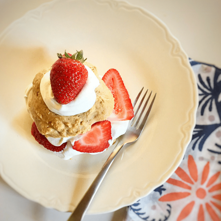 Strawberry shortcake on a white plate.