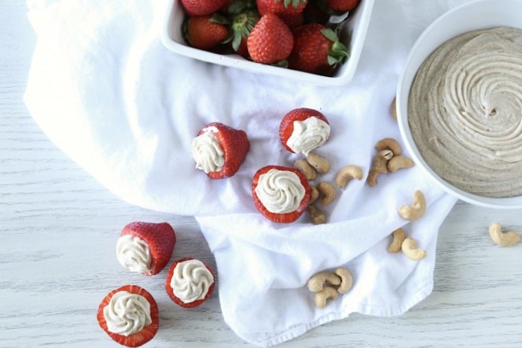 A bowl of fruit on a table, with Strawberry and Cream