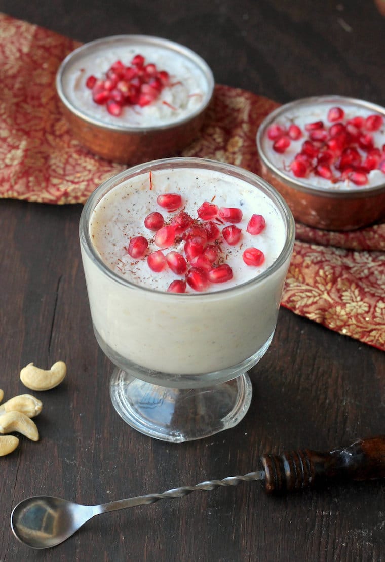 Yogurt in a glass with pomegranates