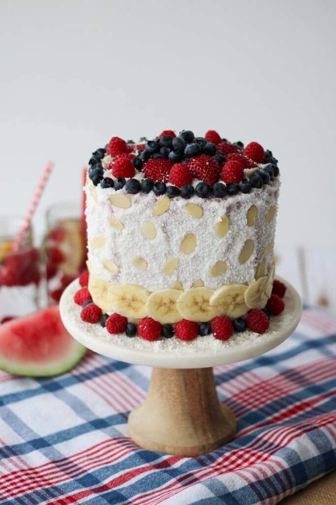 gluten free and vegan red white and blue watermelon cake garnished with fruit