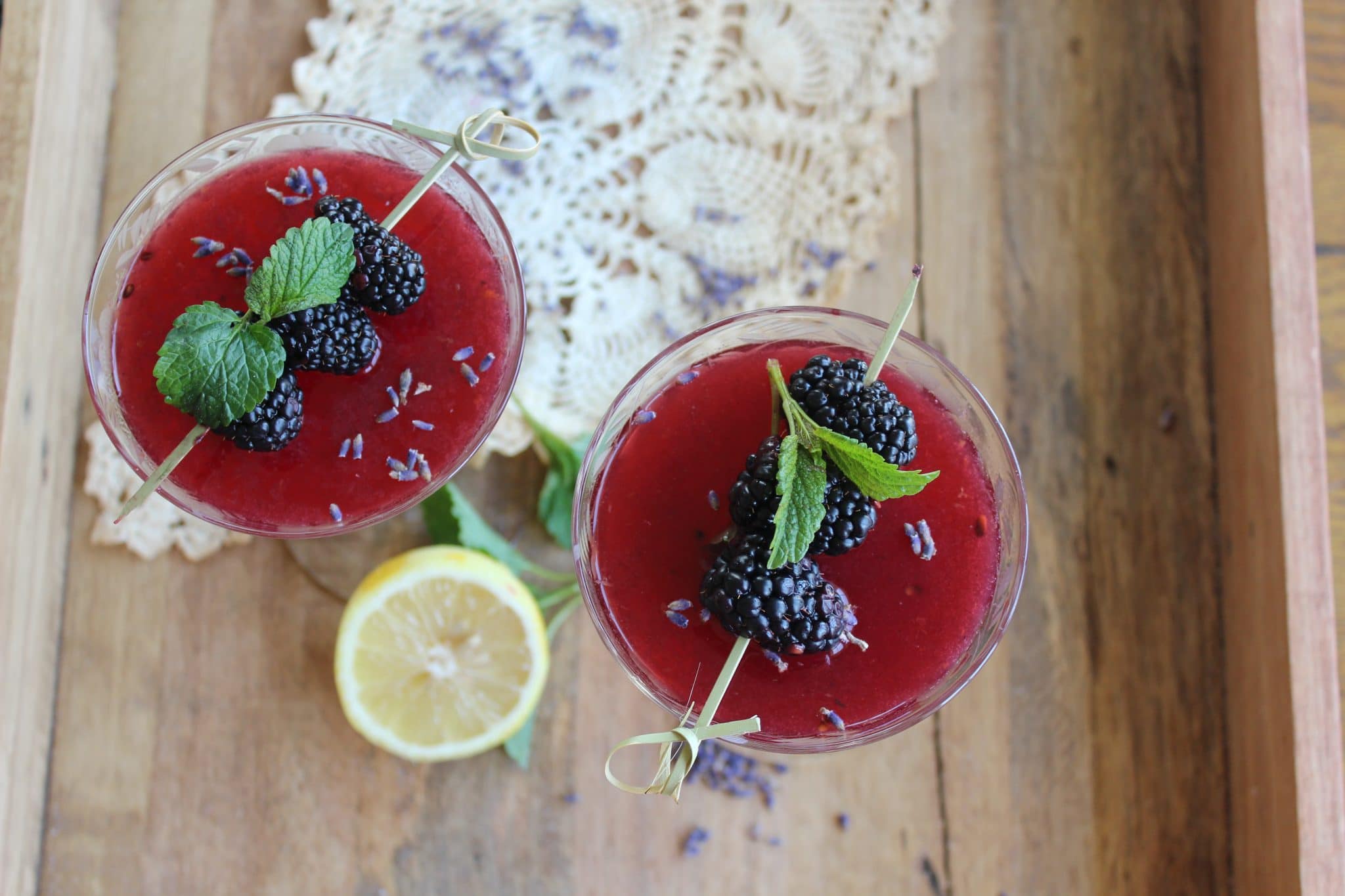 birds eye view of lavender and blackberry spritz topped with blackberries and mint