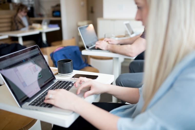 Women working on laptops. 