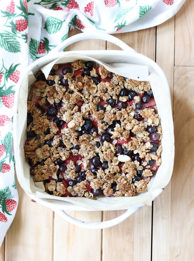 birds eye view of berry oatmeal bake in a white baking pan 