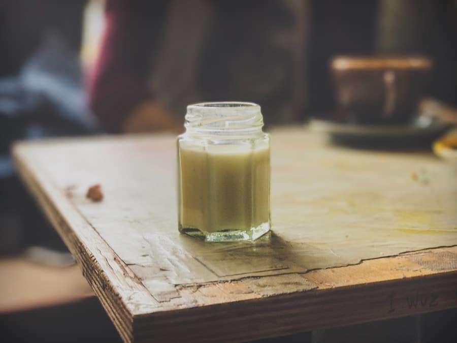 Small clear glass on a wooden table.