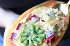 This Vegan Tropical Mango Smoothie Bowl in an Edible Papaya Bowl is a healthy summer breakfast for busy days.