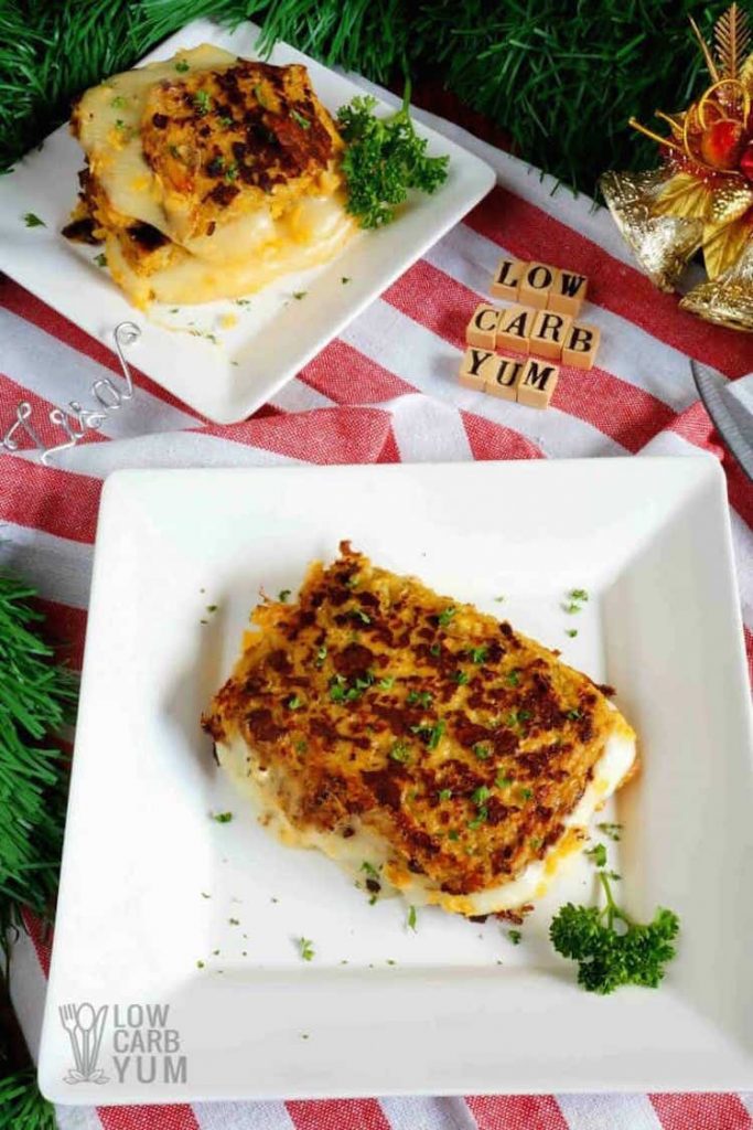 birds eye view of low carb cauliflower grilled cheese sandwiches on a white plate garnished with fresh herbs 