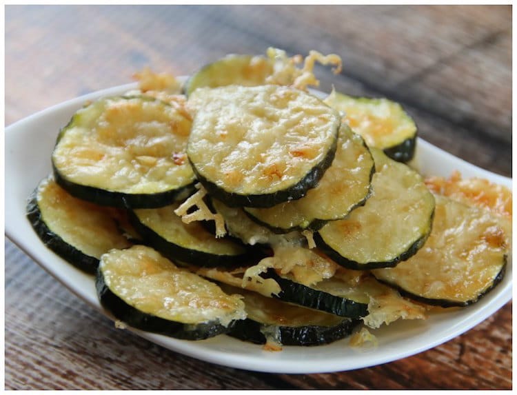 white plate filled with healthy parmesan zucchini chips