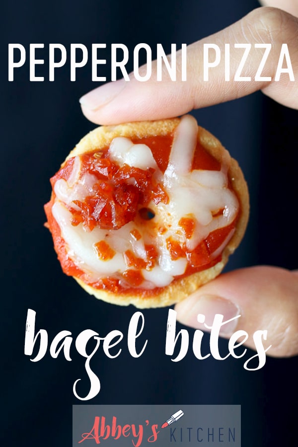 pinterest image of Hand holding homemade bagel bites with text overlay