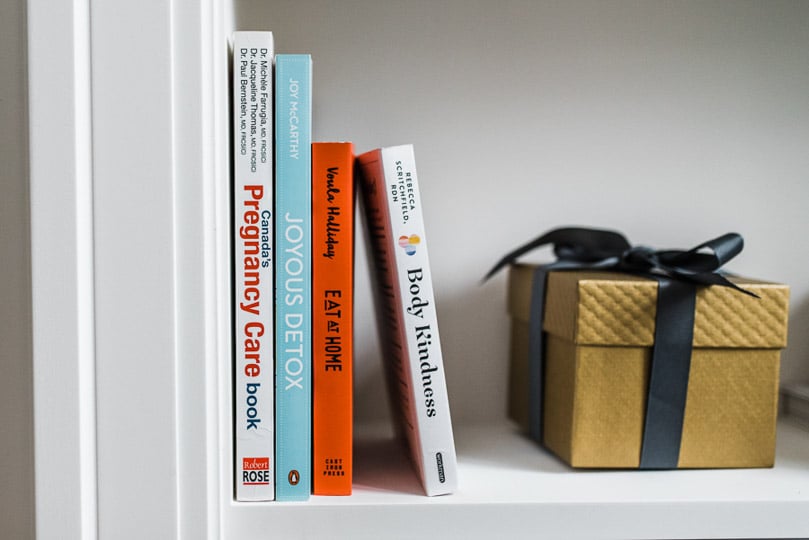 lineup of baby books on a shelf