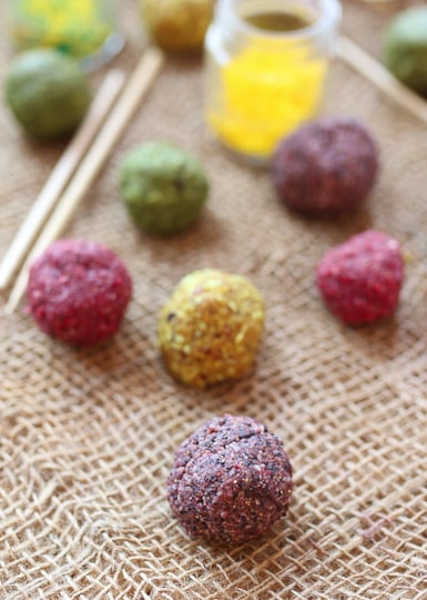 Colourful cake pop balls on a burlap blanket