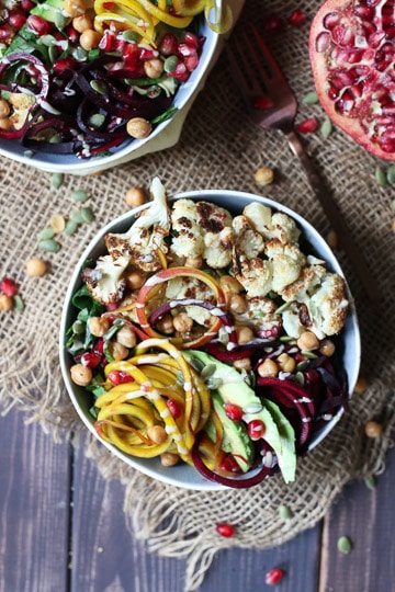 birds eye view of vegan tahini and beet buddha bowl in a large white bowl