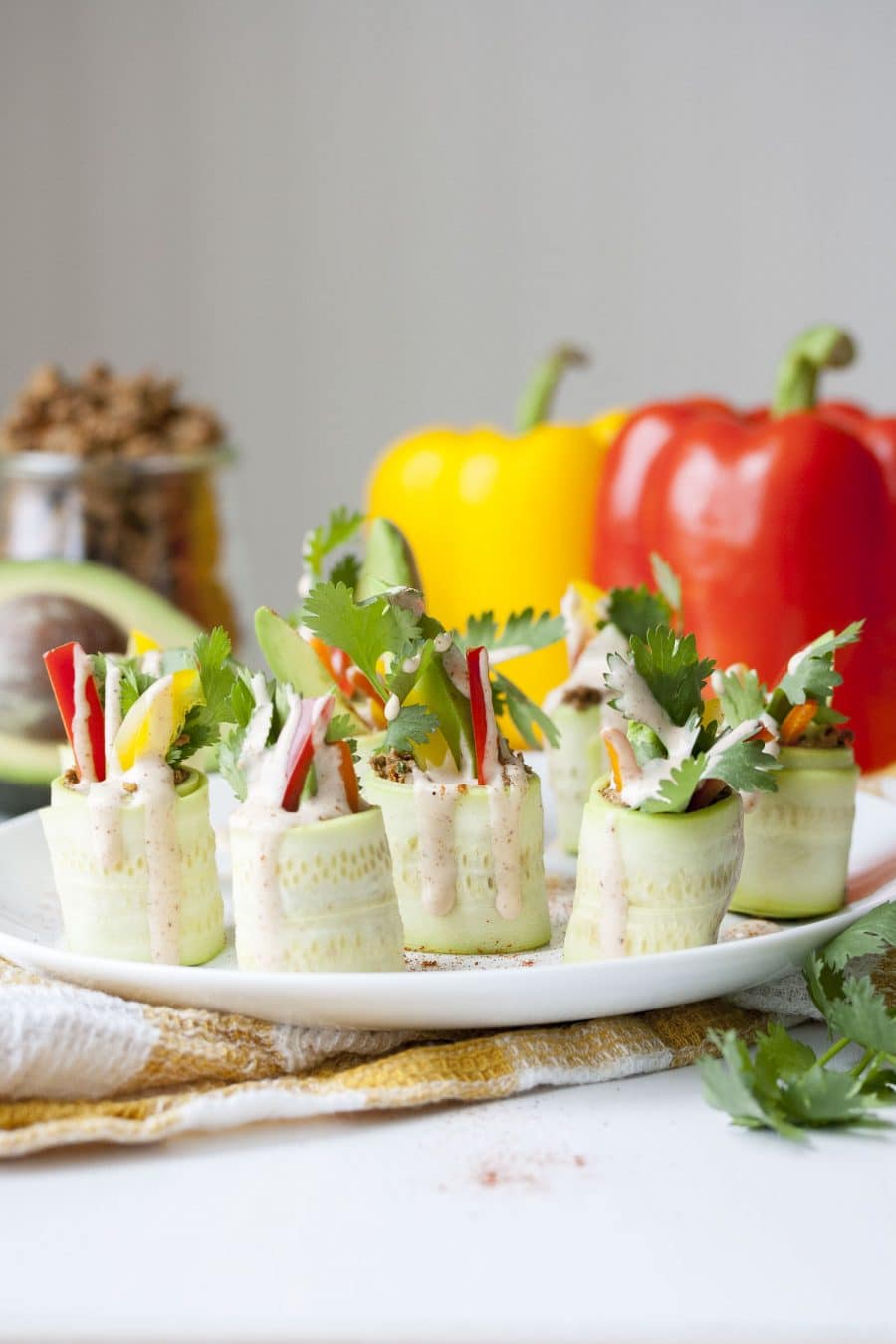 Zucchini roll ups on a plate.