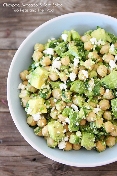 close up of gluten free chickpea, avocado, and feta salad in a white bowl