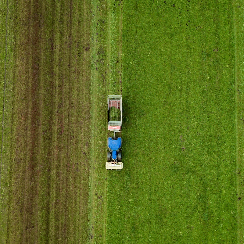 Tractor driving through field.