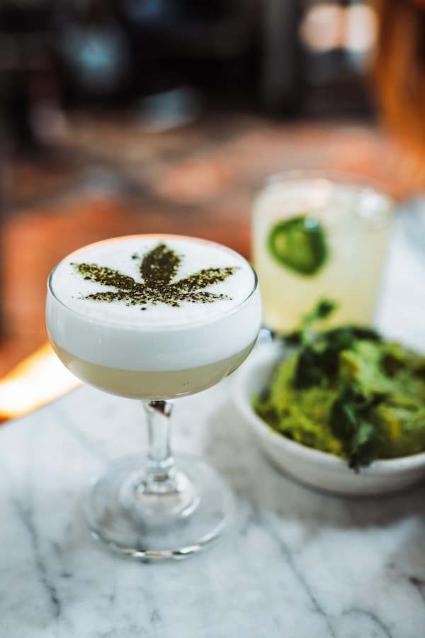 Cocktail with a cannabis logo on top.