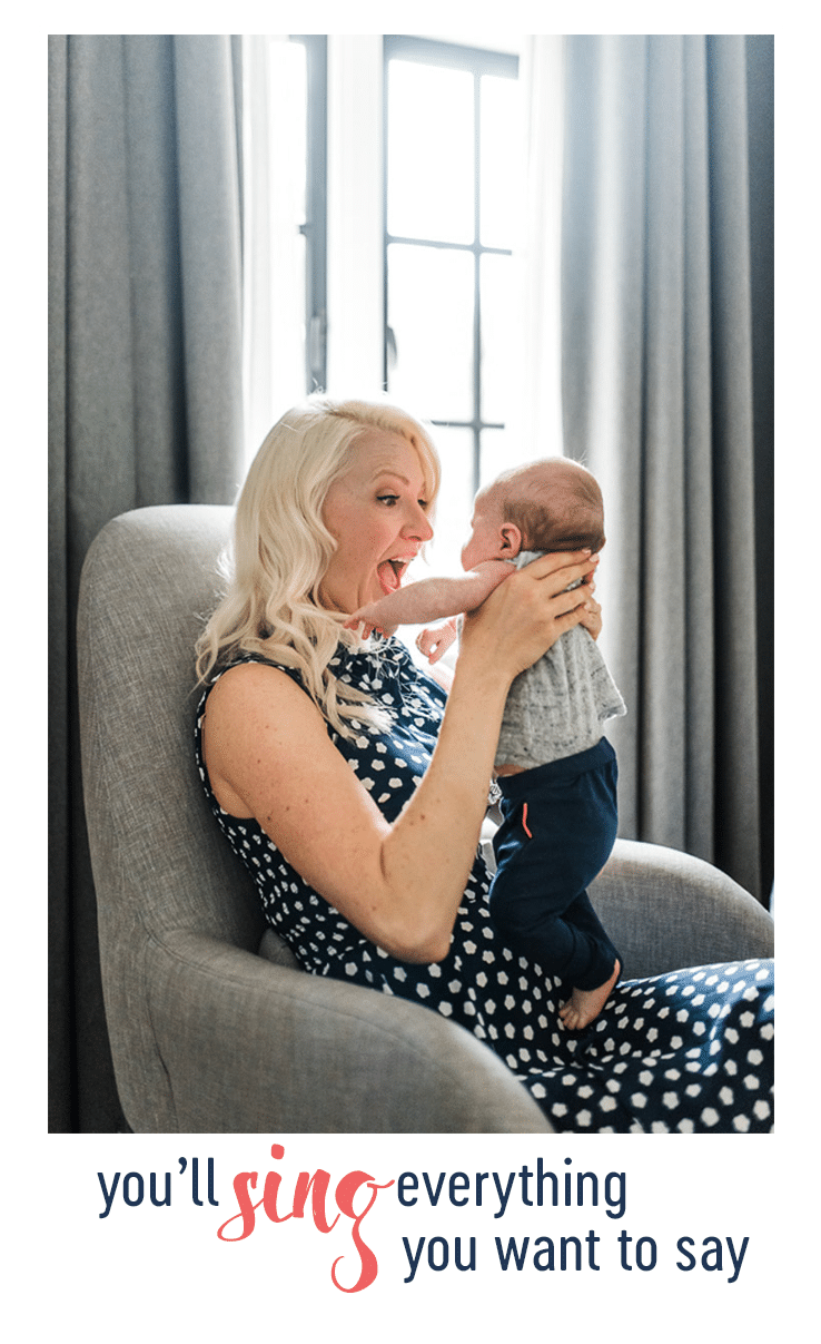 abbey holding baby E on a chair