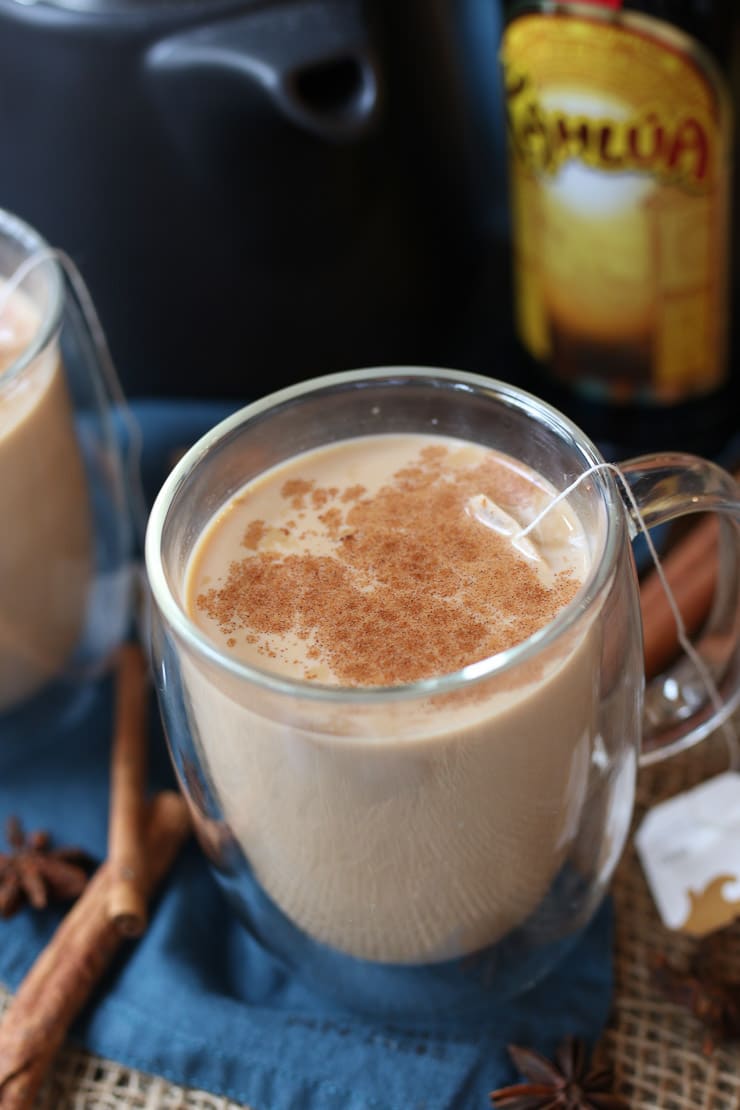 close up of dirty Chai tea cocktail in a glass mug for the holidays. 