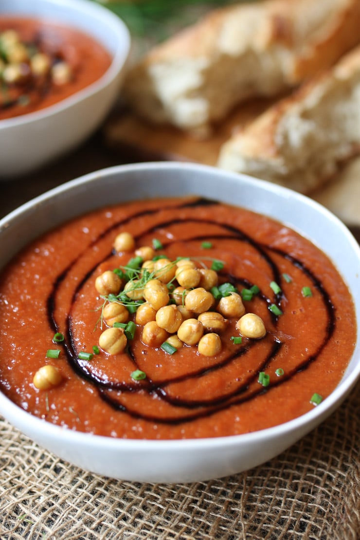 vegan tomato and fennel soup in a white bowl topped with chickpea croutons