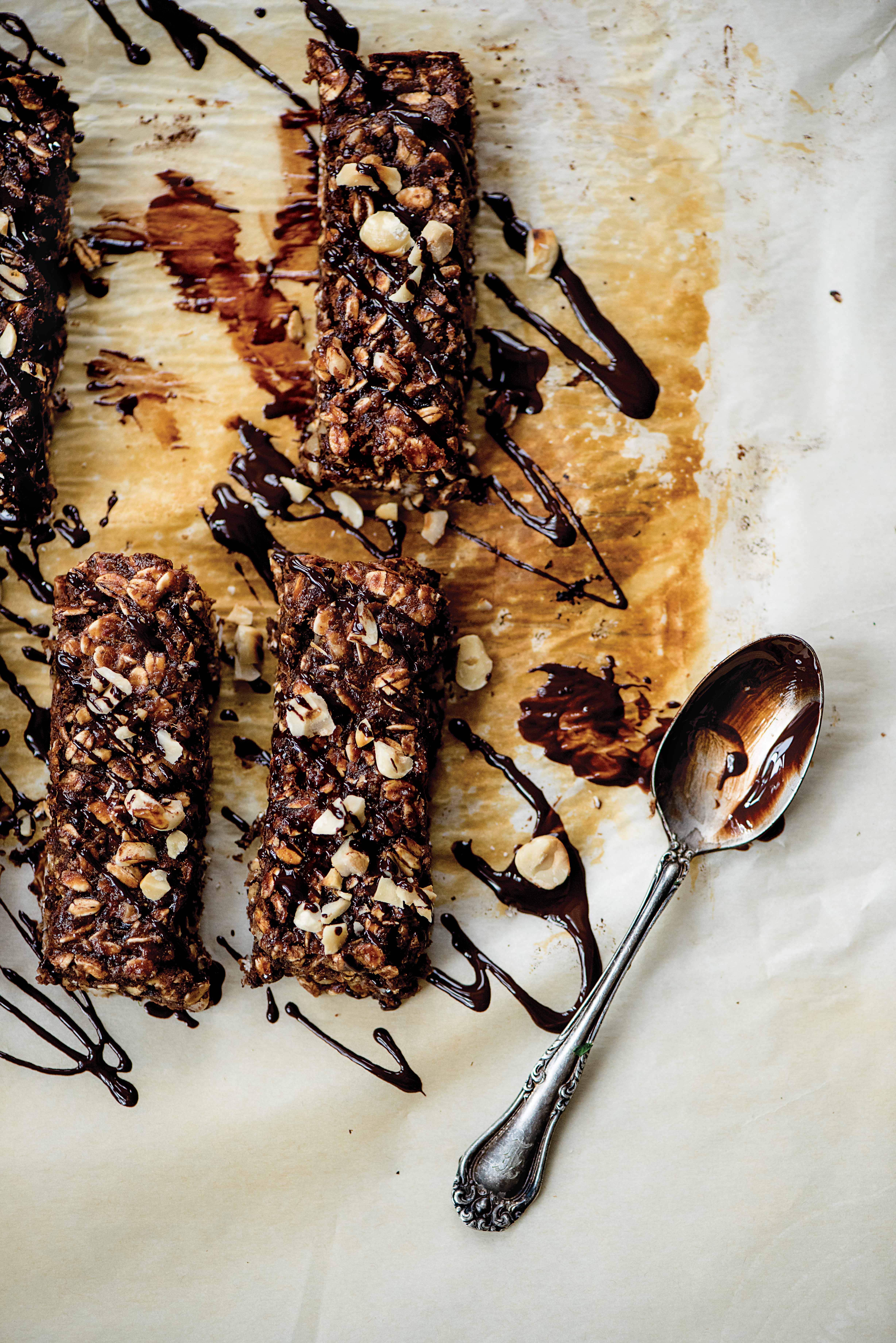 birds eye view of chocolate hazelnut protein bars drizzled with chocolate and chopped hazelnuts 