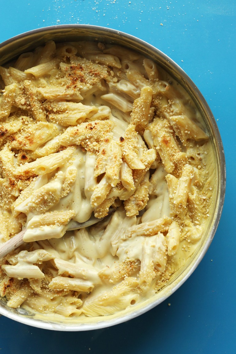 close up shot of Penne mac and cheese in a pan.