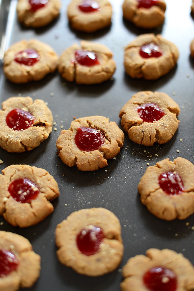 Thumbprint cookies on a baking tray.