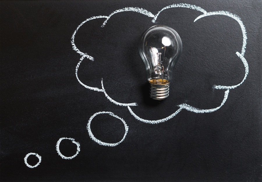 Light bulb on a blackboard.