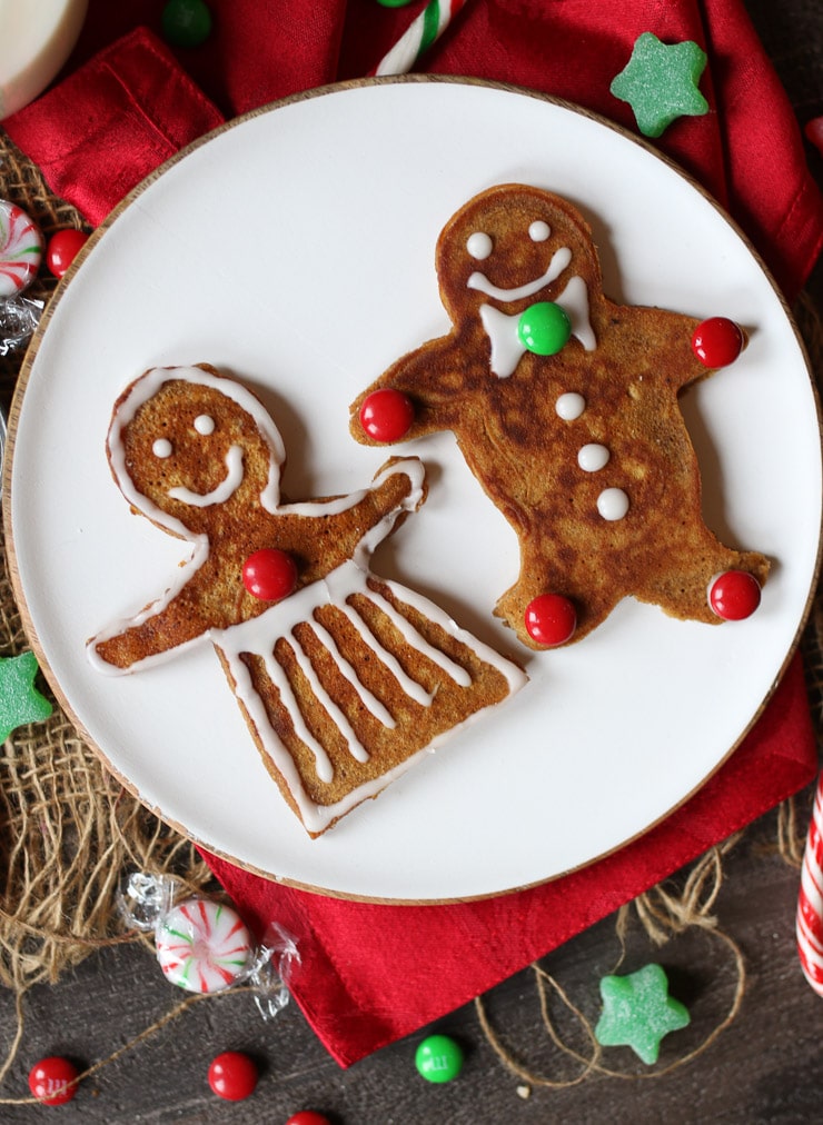 birds eye view of gingerbread man pancakes for the holidays on a white plate