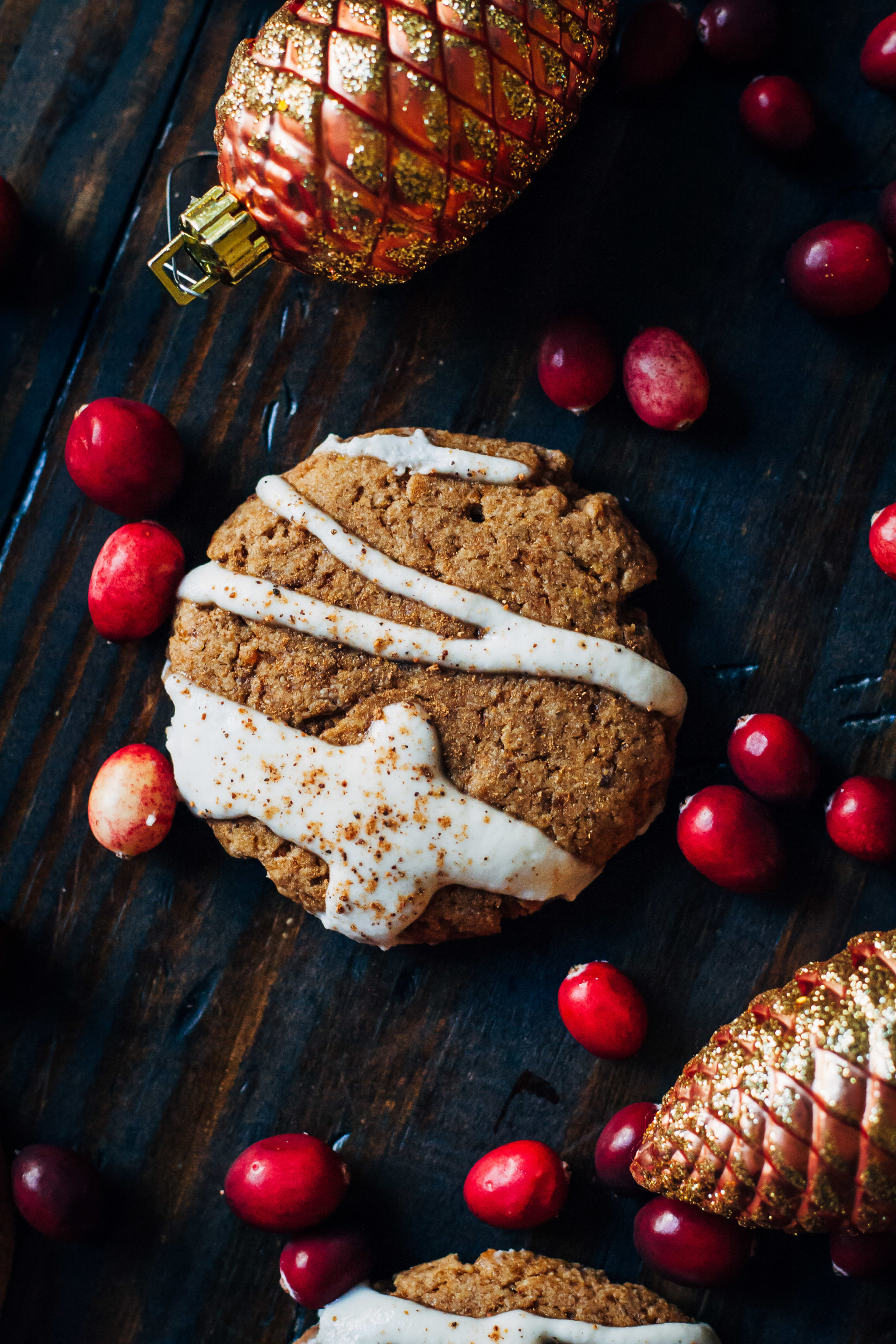 Christmas cookie next to decorations.