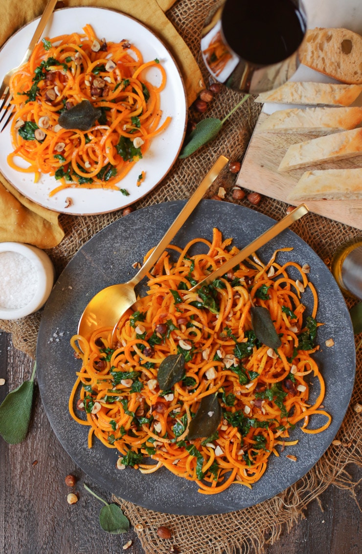 birds eye view of brown butternut squash noodles on a grey plate 