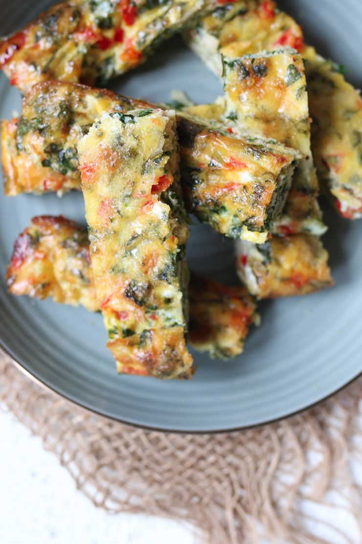 Frittata fingers on a teal plate.