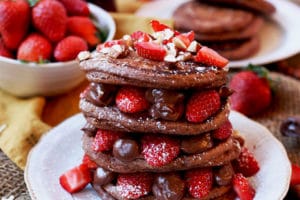 These Vegan Nutella Protein Pancakes make a delicious Healthy Gluten Free Valentine's Day Breakfast Recipe for a plant-based breakfast in bed! #abbeyskitchen #nutellapancakes #valentinesdaybreakfast