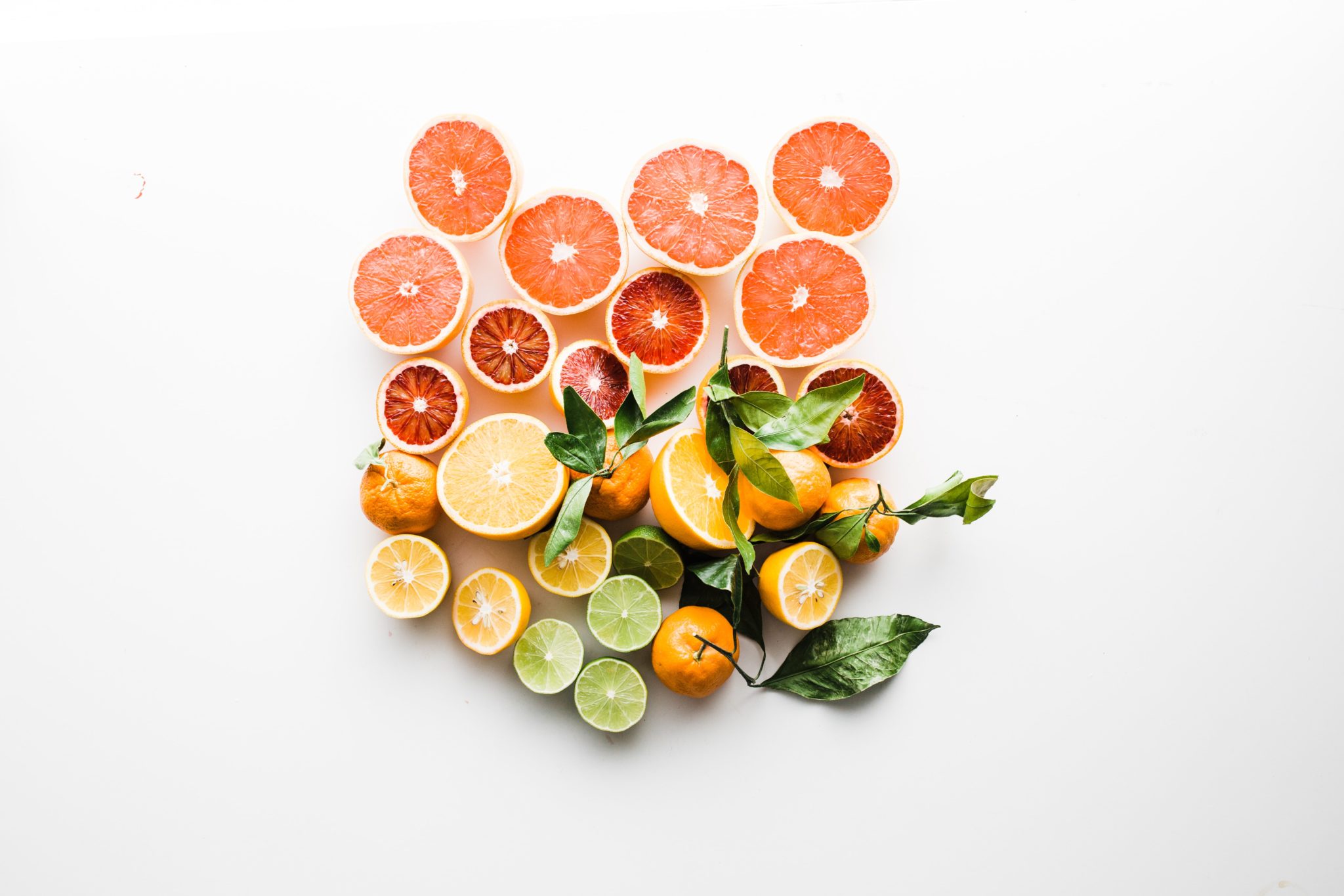 birds eye view of various fruits on a white background