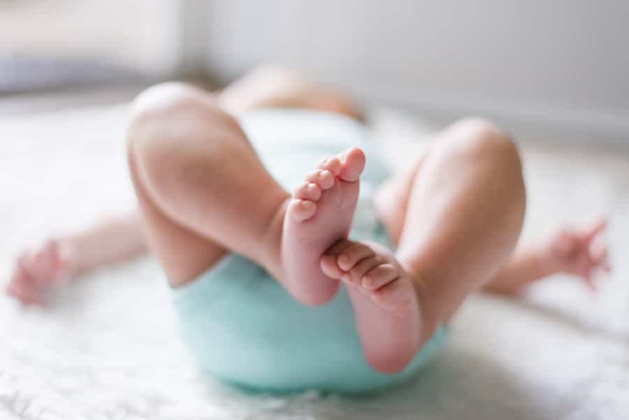 Baby's feet lying on its back.