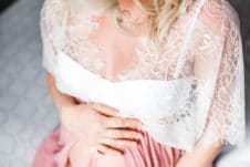Women holding her pregnant belly.