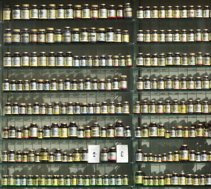 Entire shelf of supplements in a store.