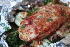 Baked chicken parmesan foil pack dinner with vegetables.