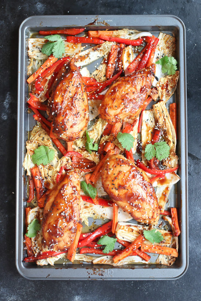 Four sticky chicken breast sheet pan dinner with cabbage and peppers.
