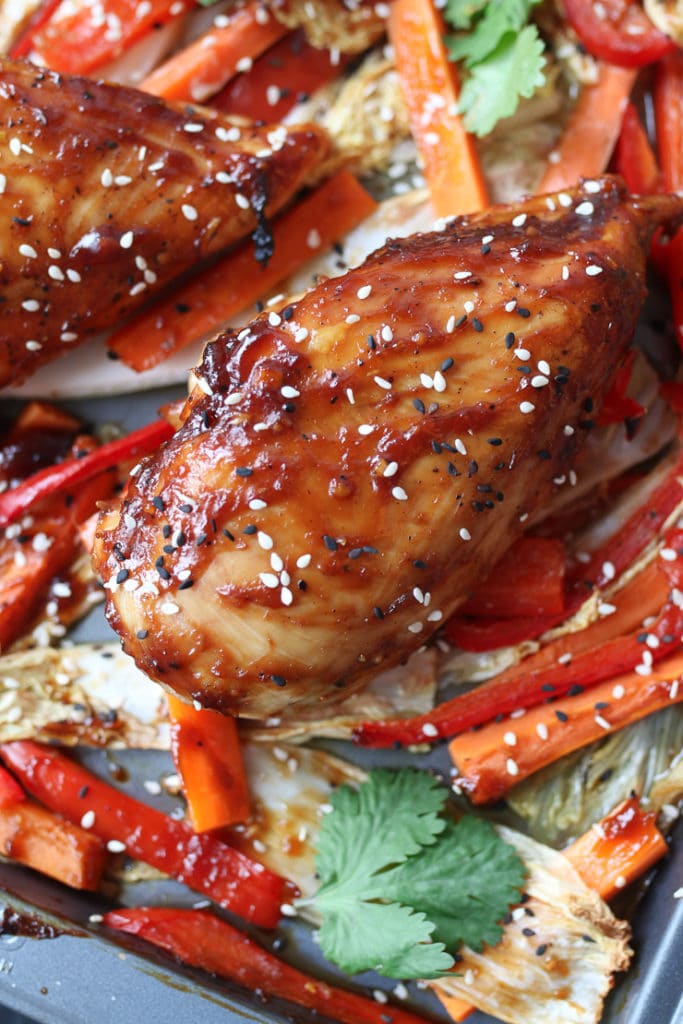 Sticky chicken breast on cabbage and peppers .