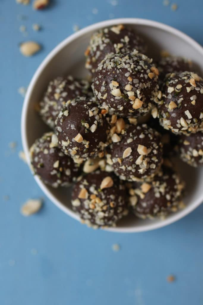 Peanut butter chocolate protein balls in a bowl.