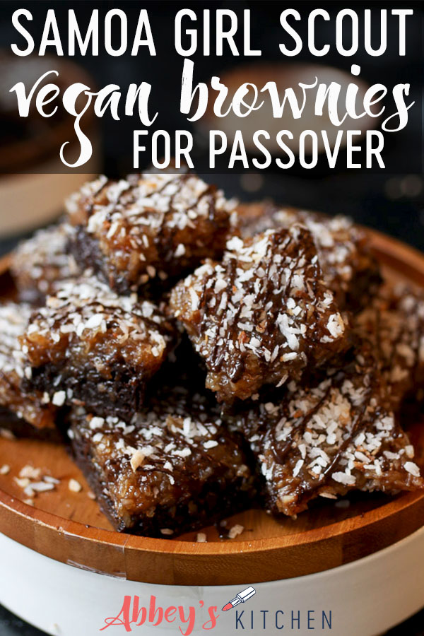 Samoa girl scout vegan brownies on a wooden plate topped with chocolate and coconut.