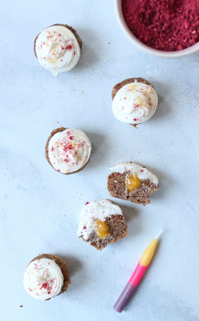 Mini vegan cupcakes cut open to show chia mango jam filling.