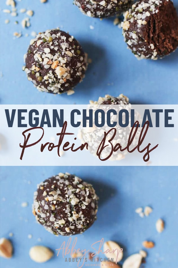 pinterest image of birds eye view of vegan chocolate and peanut butter protein balls rolled in hemp hearts and chopped peanuts on a blue background with text overlay