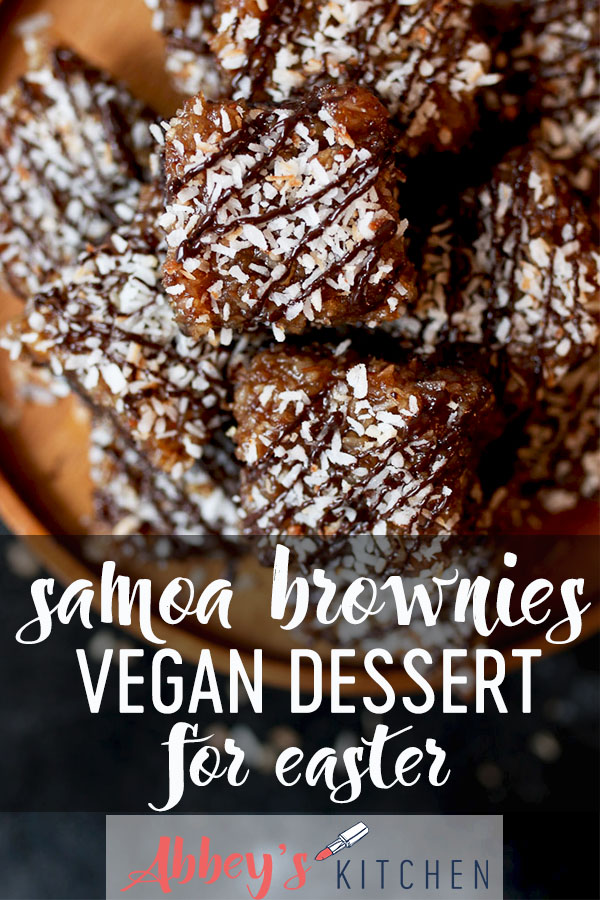 Samoa girl scout vegan brownies on a wooden plate topped with chocolate and coconut.