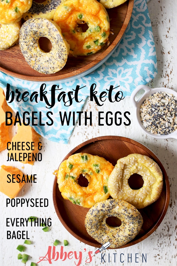 Keto everything bagel, jalepeno cheddar and poppyseed bagels on a wooden plate.