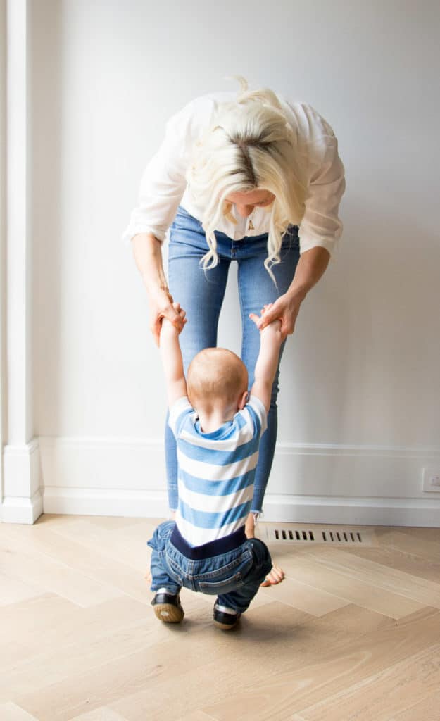 Women holding her baby boy.