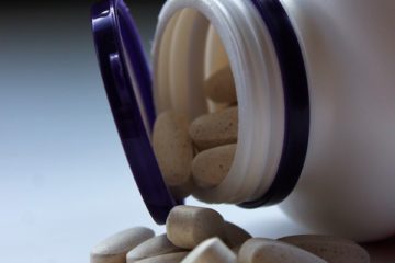 A pill bottle containing iron supplements.