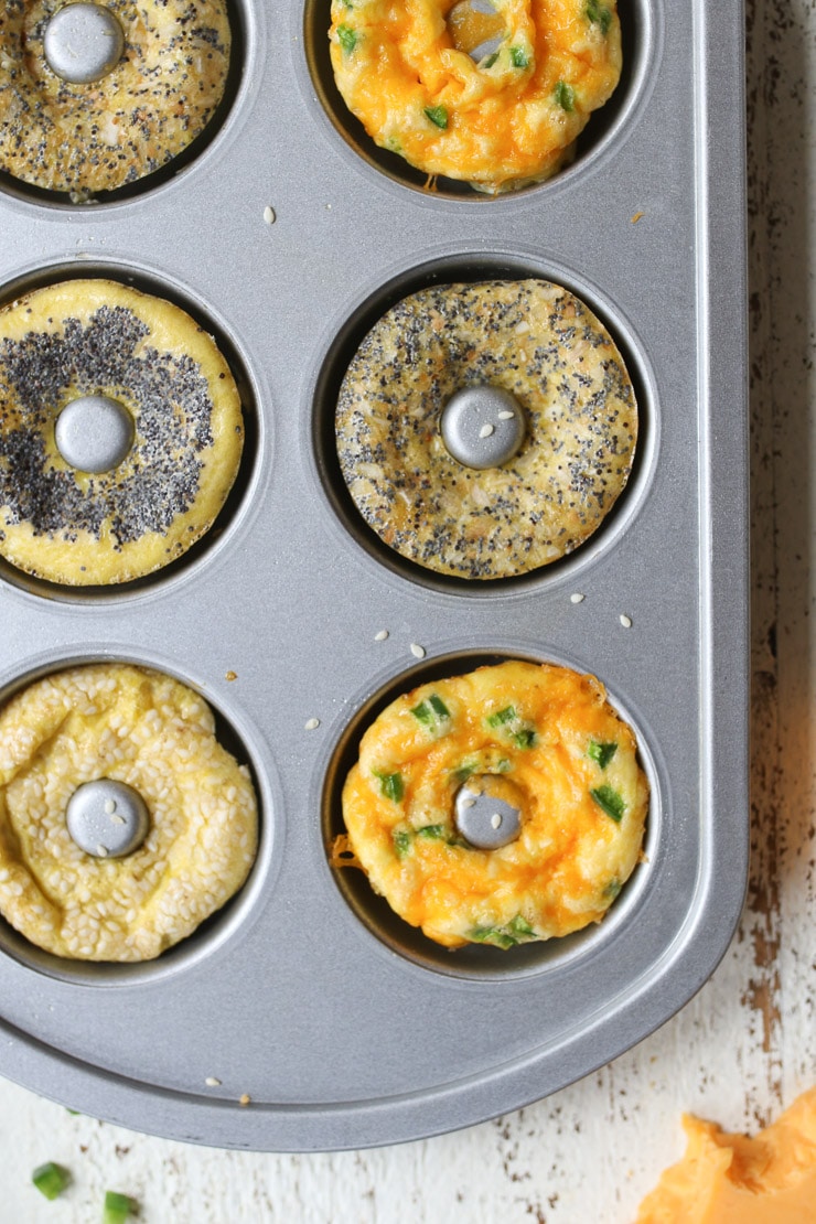 Keto everything bagel, jalepeno cheddar and poppyseed bagels in a baking pan.  