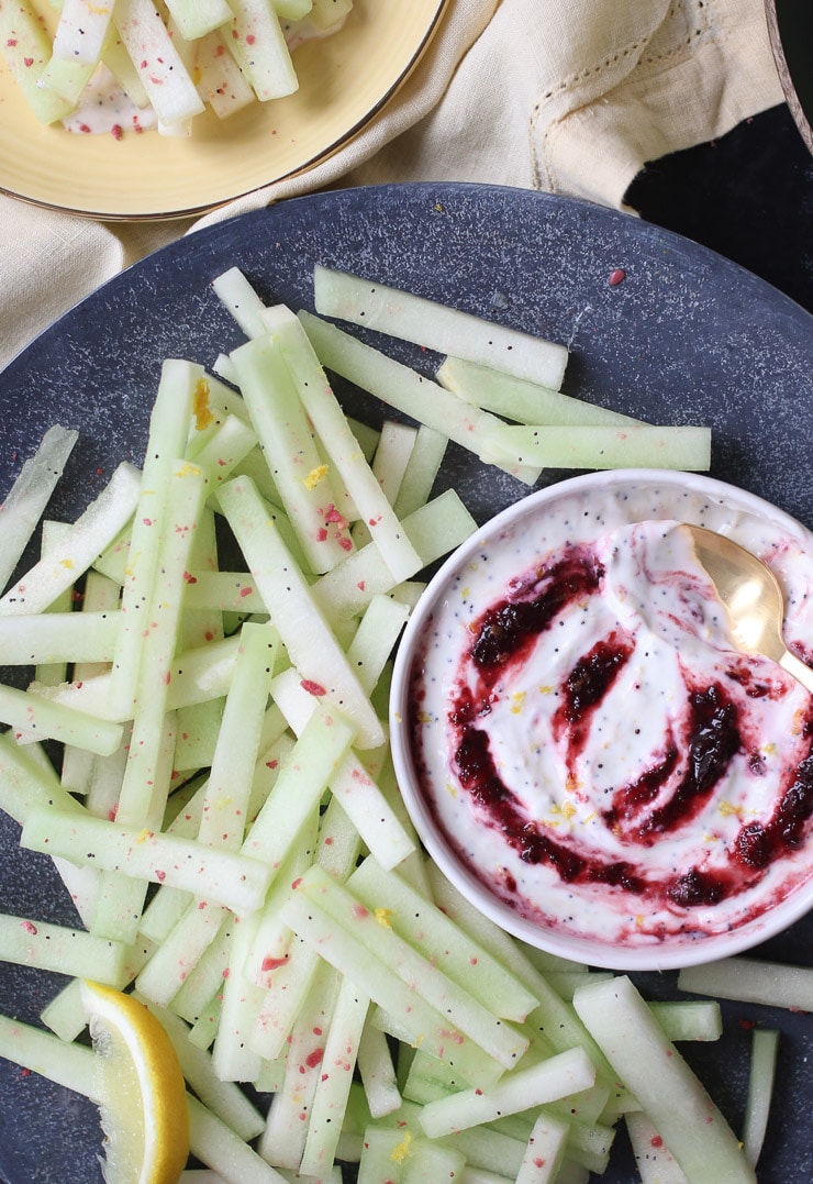 Honeydew melon fries next to poppyseed cherry dip. 