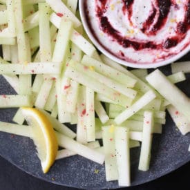 Honeydew melon fries next to poppyseed cherry dip.