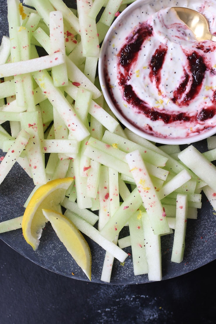 Honeydew melon fries next to poppyseed cherry dip.